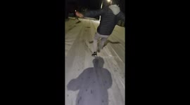 Guy slips and falls on icy street in Tipton, England