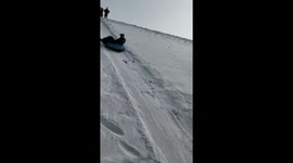 Person falls while sliding on snow in Gansu, China