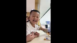 Young boy in China smiles through blood draw