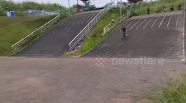 Cyclist slams head-over-handlebars on race track