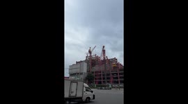 Crane falls from construction site killing one and injuring three workers in Taiwan