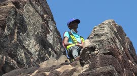 Brave local climbs temple to wrestle with monkey that stole tourist's phone