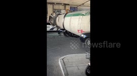 Miraculous escape for motorist after vehicle flattened by concrete mixer in China