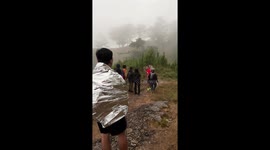 Enraged cow chases away terrified hikers on mountainside