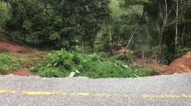 Landslide swallows up road as heavy rain hits southern Thailand