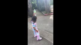 Aggressive monkey mugs children for a bottle of water