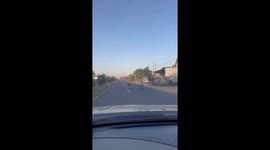 Motorcycle rider lies flat on bike like superman