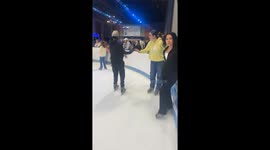 Girl falls over while ice skating after friend pretends to push her over