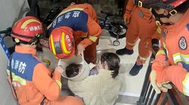 Firefighters save girl with trash can stuck on her head in China