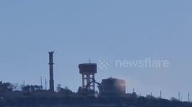 Lebanon: An Israeli bulldozer demolishes a house in the town of Maroun al-Ras