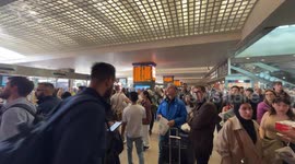 Travelers stopped at the Rome Termini station waiting to be able to catch a train while the boards signal severe delays in train departures and arrivals due to a technical fault at the Termini and Tiburtina railway stations in Rome.
