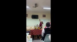 Talented teacher shows off her bartending bottle skills to students