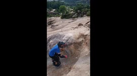 Chinese boy climbs mountain on electric unicycle