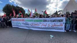 Pro-Palestine protesters display banners reading ‘Palestine and Lebanon united, stop the genocide with resistance!’ during a pro-Palestinian rally in Rome.