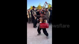 Eight-year-old boy delights crowd with enthusiastic drum performance in China