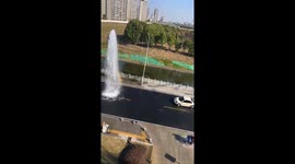 Cars queue for free wash from burst water pipe in China