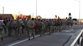 US: March of Joy Soldiers Carry Holiday Hope