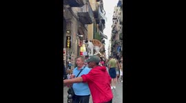 Guy Carries Cat on His Head