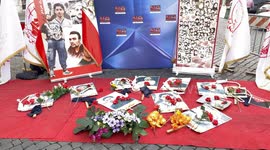 A composition of photos of men executed by death penalty and nooses near their photos during the protest against executions in Iran organized by activists of the National Council of Resistance of Iran in Rome.