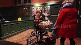 Amazing dress made out of dog biscuits attracts a hungry dog at the K-9 Angels Christmas Carol Concert in aid of rescue dogs