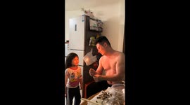 Father performs magic trick with fire for daughter in Guangdong, China