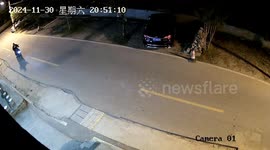 Motorcyclist hits parked car and escapes unscathed in Zhejiang Province, China