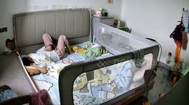 Mother retrieves baby after fall into gap beside the bed in Guangdong, China