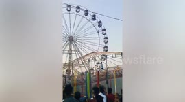 Schoolgirl dangling from 60ft high Ferris wheel gondola rescued in India
