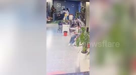 Woman falls off hanging egg chair and becomes trapped underneath it
