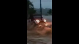 Jeep washed away by flash floods in Indonesia