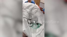 Man survives 15-metre fall onto concrete from balcony