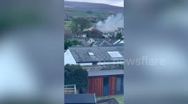 Large plume of smoke seen across town as 75 firefighters battle blaze