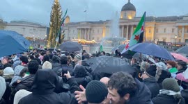 Syrians celebrate the toppling of Bashar al-Assad's government in Trafalgar Square, London