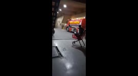 Firefighter colleagues playing with a cart in Avellaneda, Buenos Aires, Argentina