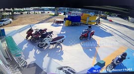 Motorcycle suddenly accelerates and crashes into sliding shop door