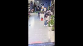 Rocking mishap: Young woman in China finds herself trapped under chair