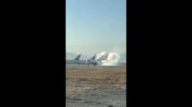Smoke pours from exhaust of plane at Afghanistan airport