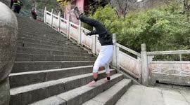 Handstand climb up the 999 steps of Tianmen Mountain