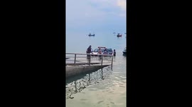 Bungling cop lets police truck roll into the sea in Thailand