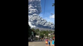 Shocked locals watch ash cloud form above erupting Kanlaon Volcano