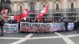 Demonstrators behind the banner with the slogan ‘against the Jubilee of business, let’s build an alternative to the Gualtieri administration’ during the protest against the model imposed on Rome by the Gualtieri administration organized by various social