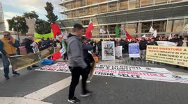 Demonstrators in Piazza del Campidoglio wave Italian flags with the slogan ‘enough environmental racism’ around a photo of Gualtieri dressed as Duce during the protest against the model imposed on Rome by the Gualtieri administration organized by various