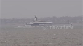 Superyacht Bravo Eugenia departs Thames in foul weather off Kent, UK