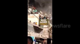 India: People trapped in a restaurant in Rajouri Garden saved their lives by jumping from a height of 10 feet to the other roof