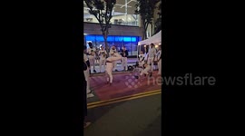 US: Two men perform Afro-Brazilian martial art in the streets of San Francisco