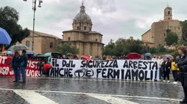 Protesters show the banner with the slogan ‘The security bill arrests you too, let's stop them!’ during the demonstrations organized by both the Movements for the Right to Housing and the grassroots union SI COBAS, which joined together in a si