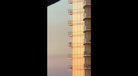 Grinch Dances on High-Rise Balcony