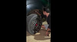 Driver rescues kitten trapped under pickup truck wheel arch
