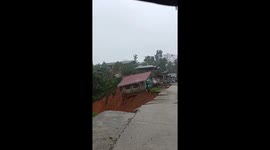 House collapses into cliff when heavy rains trigger landslide