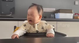Chinese Baby hilariously reacts to sour fruit puree